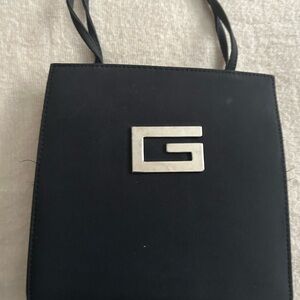 Black Shoulder Bag with Sleek Design and Structured Form